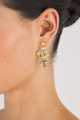Profile view of model wearing the Oroton Leora Drop Earring in Worn Gold/Silver/Clear and Brass base metal with precious metal plating/stone for Women