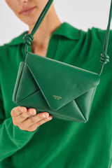 Profile view of model wearing the Oroton Elvie Crossbody in Treehouse and Smooth leather for Women