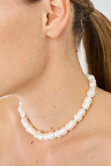 Profile view of model wearing the Oroton Marlee Necklace in Worn Gold/White and Brass for Women . IP:2