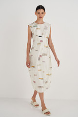 Profile view of model wearing the Oroton Structured Spaced Label Dress in Soft Cream and 100% Silk for Women