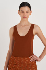 Profile view of model wearing the Oroton Knit Tank in Tan and 83% Viscose, 17% Polyester for Women