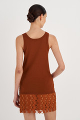 Profile view of model wearing the Oroton Knit Tank in Tan and 83% Viscose, 17% Polyester for Women