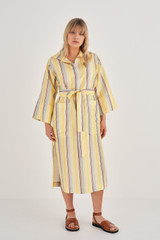 Profile view of model wearing the Oroton Stripe Dress in Daisy and 100% Silk for Women