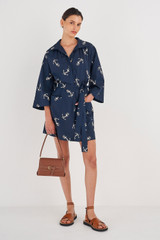 Profile view of model wearing the Oroton Anchor Print Dress in North Sea and 100% Cotton for Women