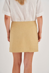 Profile view of model wearing the Oroton Pocket Detail Skirt in Raffia and 81% Viscose, 17% Cotton, 2% Elastane for Women