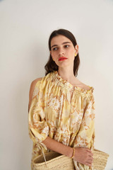 Profile view of model wearing the Oroton Garden Floral Dress in Sugarcane and 100% Linen for Women