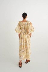Profile view of model wearing the Oroton Garden Floral Dress in Sugarcane and 100% Linen for Women