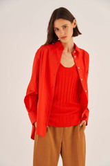 Profile view of model wearing the Oroton Poplin Long Sleeve Shirt in True Red and  for Women . IP:3