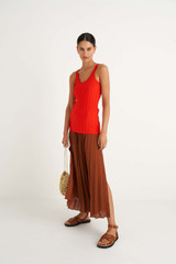 Profile view of model wearing the Oroton Pleat Skirt in Cognac and 100% Polyester for Women