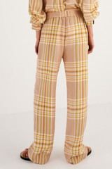 Profile view of model wearing the Oroton Check PJ Pant in Camel Check and 100% Viscose for Women