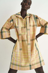 Profile view of model wearing the Oroton Short Check Dress in Camel and 100% Cotton for Women