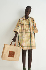 Profile view of model wearing the Oroton Short Check Dress in Camel and 100% Cotton for Women