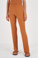 Profile view of model wearing the Oroton Rib Flare Pant in Toffee and 77% Viscose 23% Polyester for Women