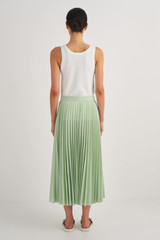 Profile view of model wearing the Oroton Pleat Skirt in Herb Garden and 65% Polyester, 35% Cotton for Women