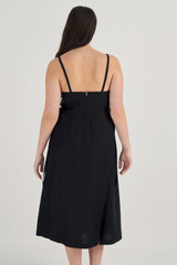 Profile view of model wearing the Oroton Linen Apron Dress in Black and 100% Linen for Women