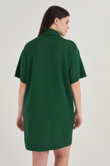Profile view of model wearing the Oroton Mesh Polo Shift Dress in Treehouse and 83% Viscose, 17% Polyester for Women