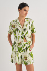 Profile view of model wearing the Oroton Garden Poppy Print Short in Soft Cream and 100% Silk for Women