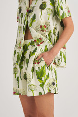 Profile view of model wearing the Oroton Garden Poppy Print Short in Soft Cream and 100% Silk for Women