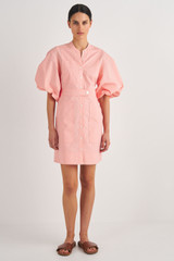 Profile view of model wearing the Oroton Short Utility Dress in Primrose and 100% Cotton for Women