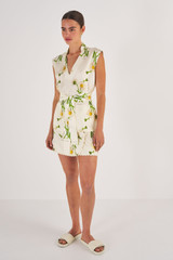 Profile view of model wearing the Oroton Field Daisy Tunic in String and 100% Silk for Women
