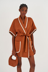 Profile view of model wearing the Oroton Contrast Bind Robe in Brandy and 100% Linen for Women