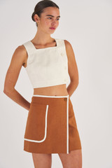 Profile view of model wearing the Oroton Contrast Bind Wrap Skirt in Brandy and 100% Linen for Women