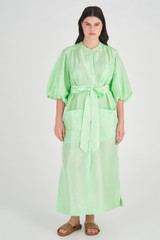 Profile view of model wearing the Oroton Column Shirt Dress in Pear and 100% Silk for Women