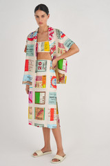 Profile view of model wearing the Oroton Ticket Print A Line Skirt in Fuchsia and 100% Silk for Women