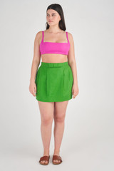 Profile view of model wearing the Oroton Bow Detail Skirt in Garden and 100% Linen for Women