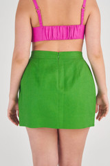 Profile view of model wearing the Oroton Bow Detail Skirt in Garden and 100% Linen for Women
