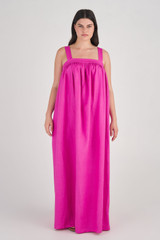 Profile view of model wearing the Oroton Bow Detail Sundress in Fuchsia and 100% Linen for Women