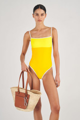 Profile view of model wearing the Oroton Contrast Bind One Piece in Vibrant Yellow and 78% Recycled Nylon/ 22 % Lycra for Women