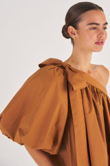 Profile view of model wearing the Oroton One Shoulder Gathered Dress in Brandy and 100% Cotton for Women