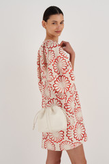 Profile view of model wearing the Oroton Curtis Crossbody in Clotted Cream and Recycled Smooth Leather for Women