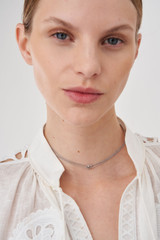 Profile view of model wearing the Accessories Wrenley Necklace in Silver and Brass Base Metal With Rhodium Plating for Women