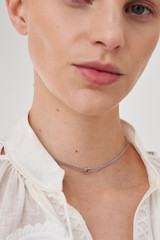 Profile view of model wearing the Accessories Wrenley Necklace in Silver and Brass Base Metal With Rhodium Plating for Women