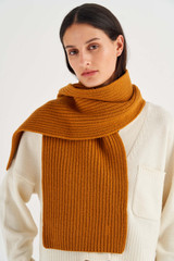 Profile view of model wearing the Oroton Woods Knit Scarf in Tan and 100% Merino Wool for Women