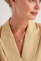 Profile view of model wearing the Oroton Minnie Necklace in Silver and Brass Base With Rhodium Plating for Women