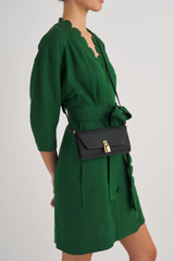 Profile view of model wearing the Oroton Tate Crossbody in Black and Pebble Leather for Women