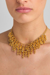 Profile view of model wearing the Oroton Riley Layered Necklace in Worn Gold and Brass Base With 18CT Gold Plating /Cubic Zirconia for Women . IP:3