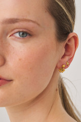Profile view of model wearing the Oroton Starfish Necklace And Stud Set in Worn Gold/Clear and Brass base metal with precious metal plating for Women