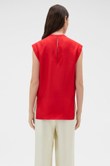 Profile view of model wearing the Oroton Silk Shell Top in Poppy and 100% silk twill fabric for Women . IP:5