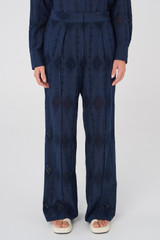 Profile view of model wearing the Oroton Lace Pant in North Sea and 100% Cotton for Women