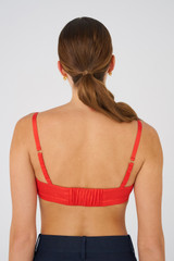 Profile view of model wearing the Oroton Silk Bralette in Poppy and 92% silk, 8% Spandex for Women