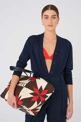 Profile view of model wearing the Oroton Silk Bralette in Poppy and 92% silk, 8% Spandex for Women