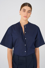Profile view of model wearing the Oroton Cotton Camp Shirt in North Sea and 100% Cotton for Women