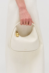 Profile view of model wearing the Oroton Clara Mini Bag in Paper White and Pebble leather for Women . IP:3
