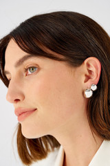 Profile view of model wearing the Oroton Josie Huggies in Silver and Sterling silver for Women . IP:2