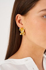 Profile view of model wearing the Oroton Lucia Earrings in Worn Gold and Brass for Women .