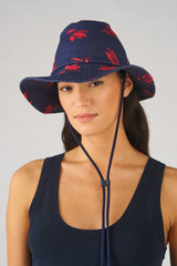 Profile view of model wearing the Accessories Boyd Printed Hat in Dutch Tulip Print and Canvas for 